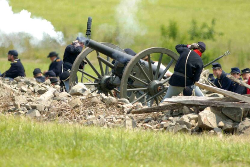 Attending a re-enactment of the Battle of Gettysburg on the historic battleground in...