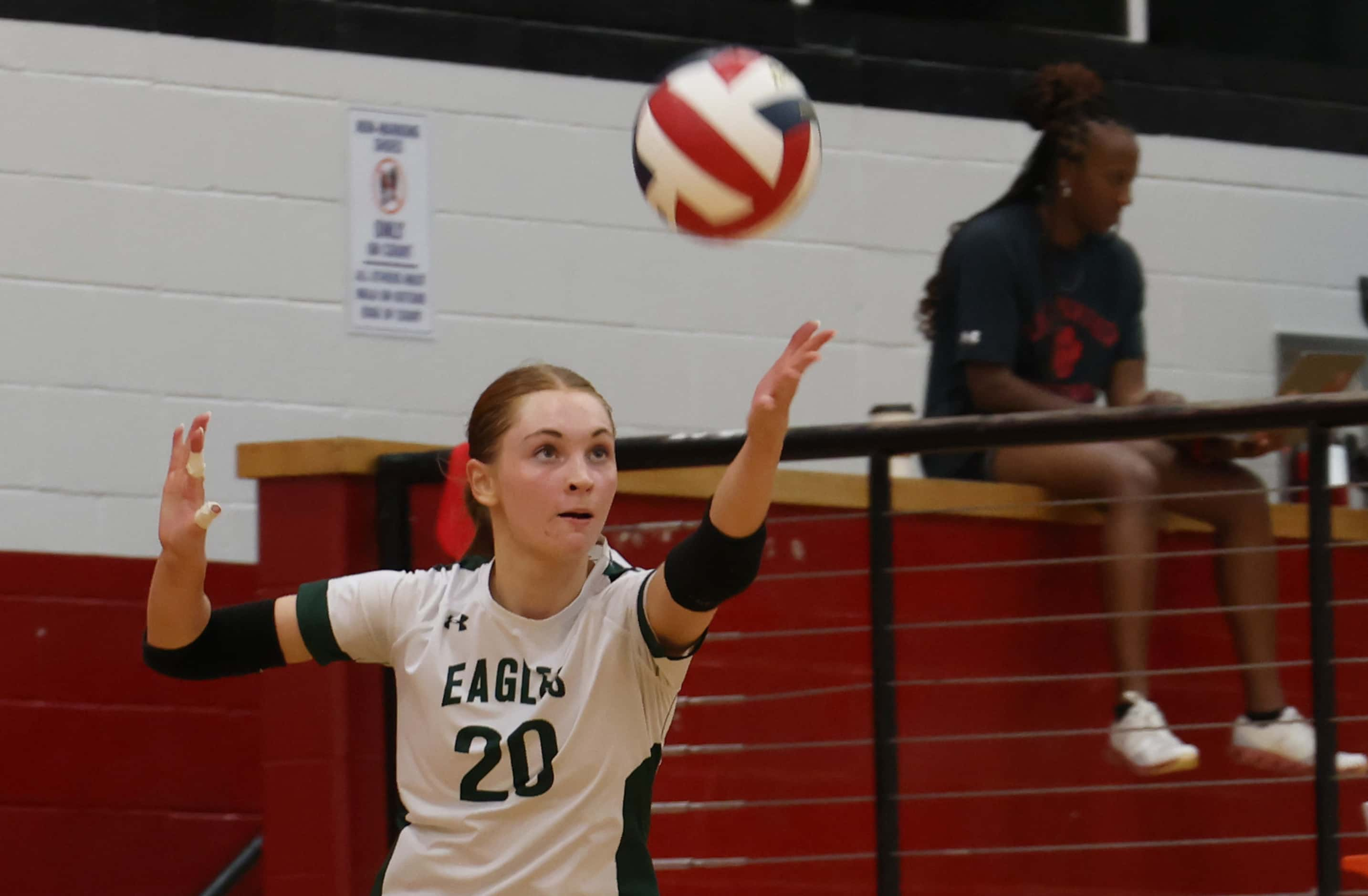 Prosper senior Sophie Bridges (20) serves during the 2nd set of their match against...