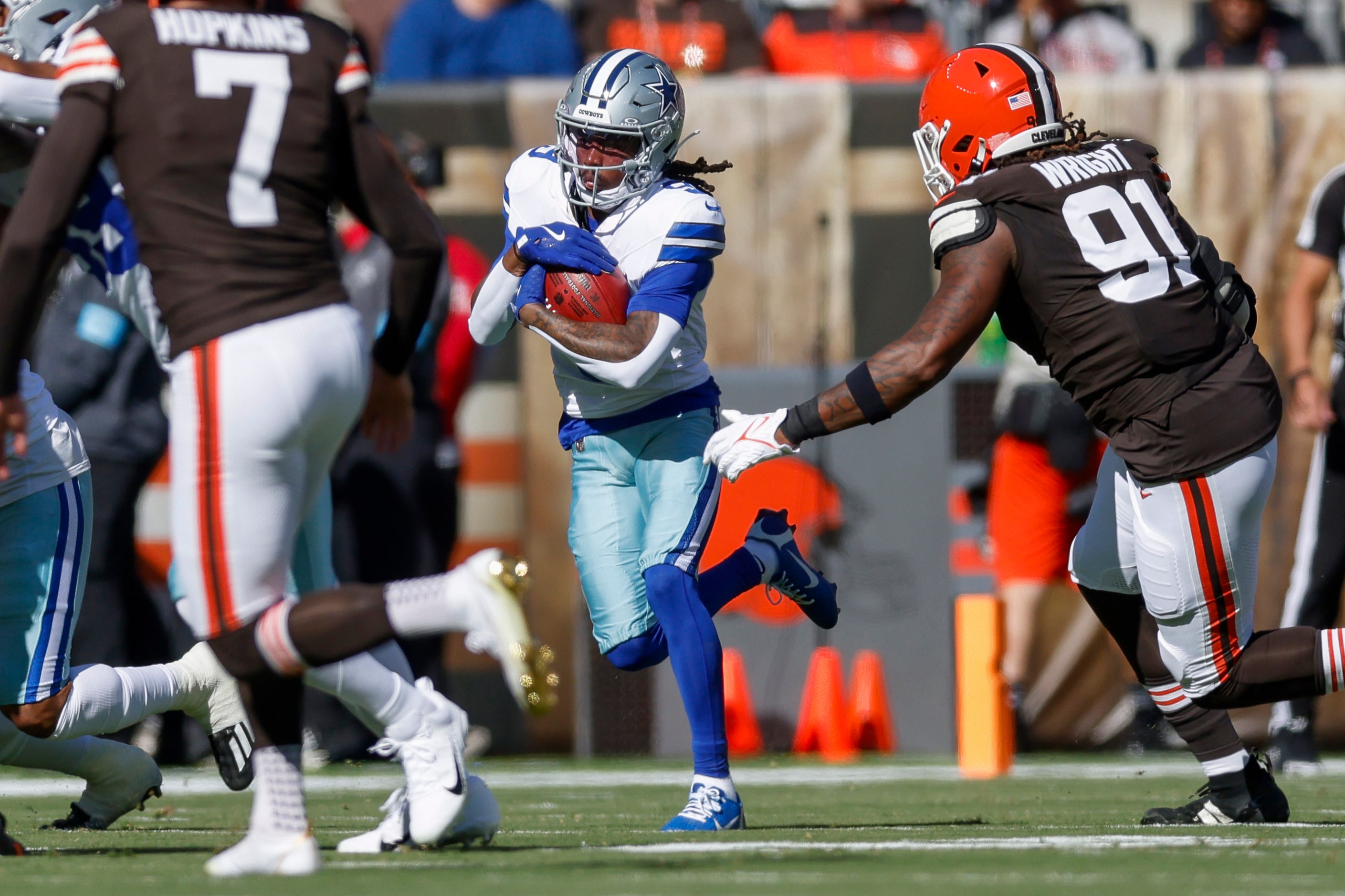 Dallas Cowboys wide receiver KaVontae Turpin (9) returns the opening kickoff past Cleveland...