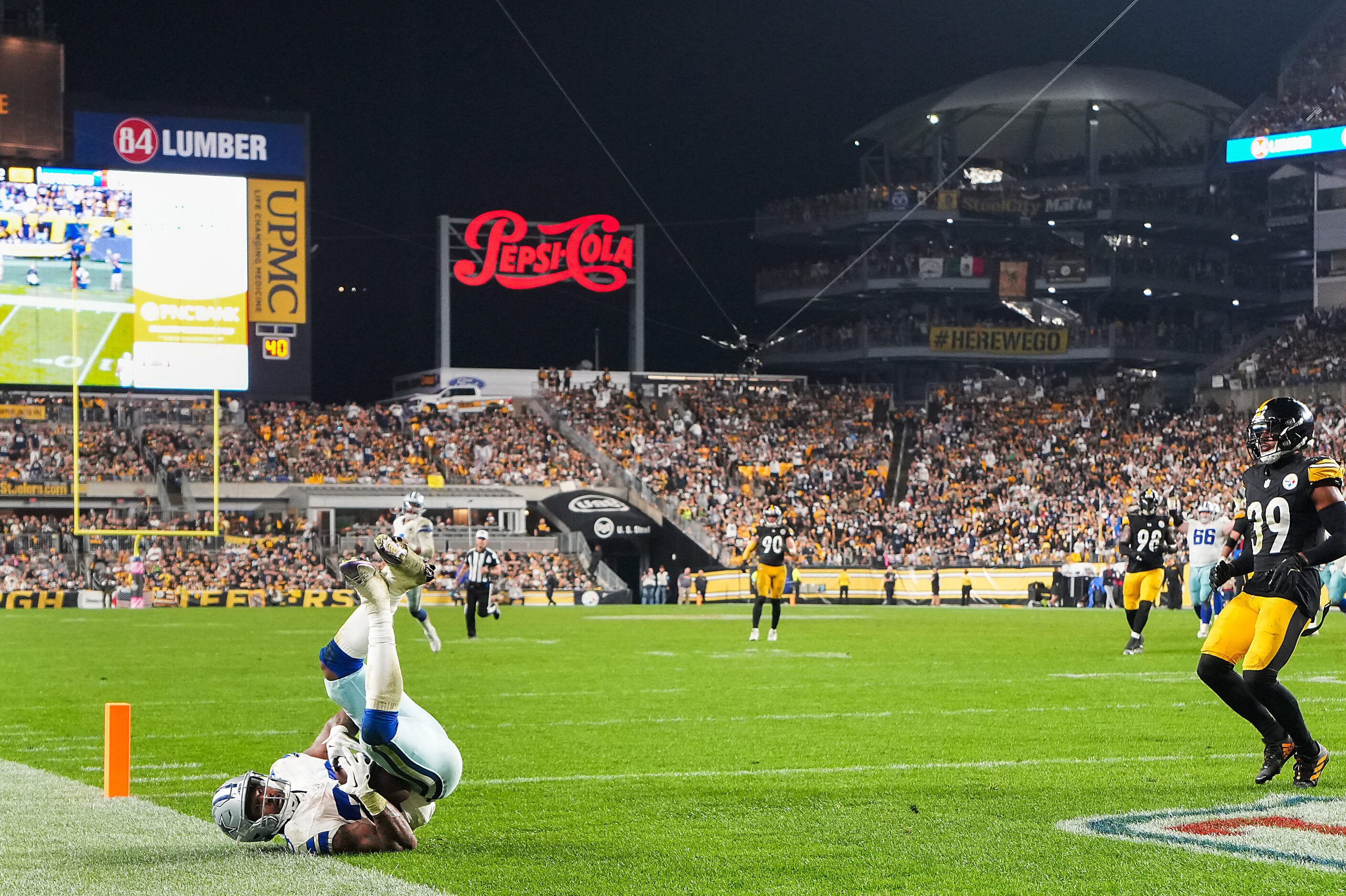 Dallas Cowboys running back Rico Dowdle (23) tumbles in to the end zone with a touchdown...