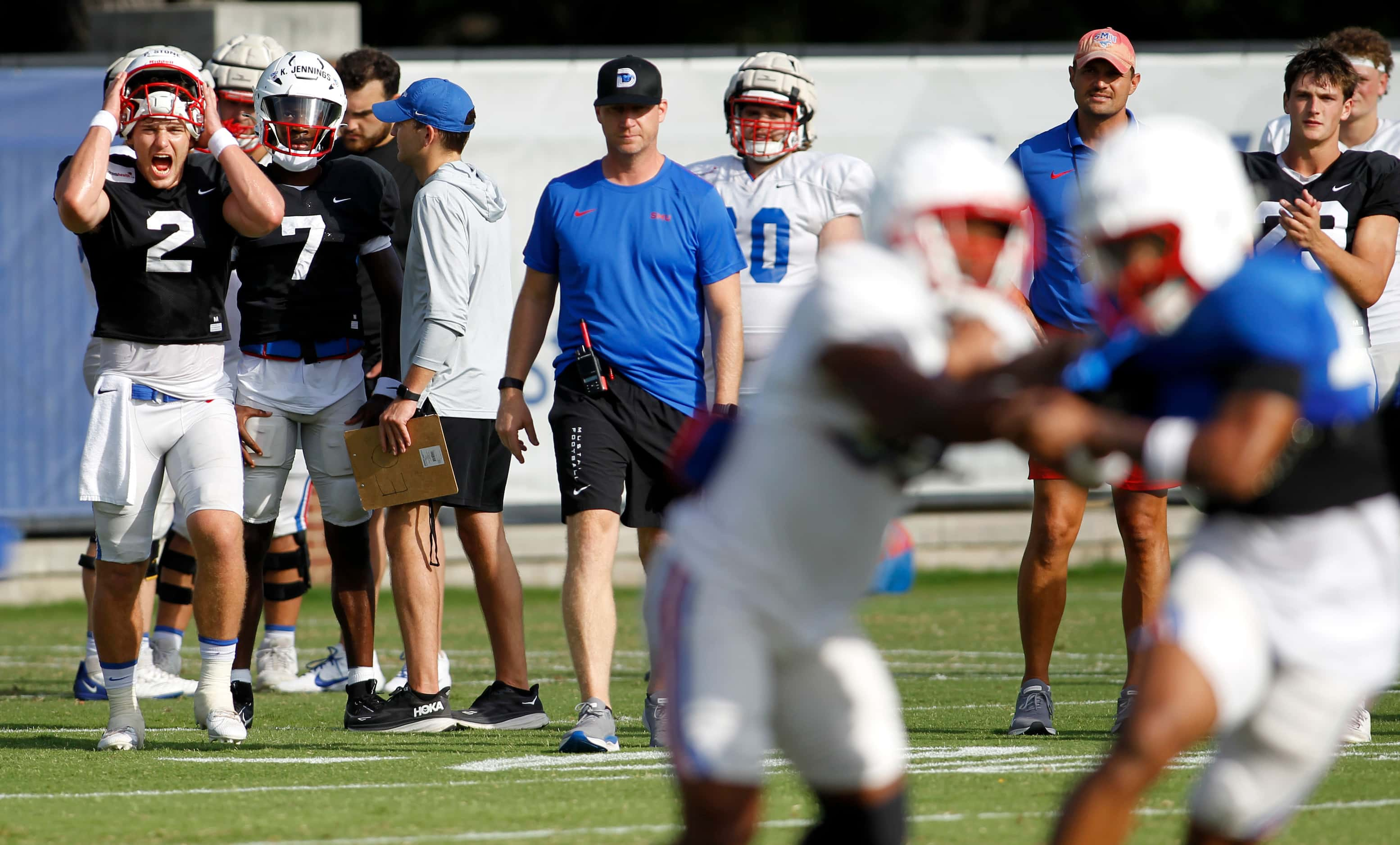 SMU Mustangs starting quarterback Preston Stone (2), far left, reacts as head coach Rhett...