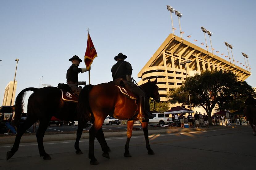 The Texas A&M mounted Corps of Cadets make their way around campus before kickoff against...