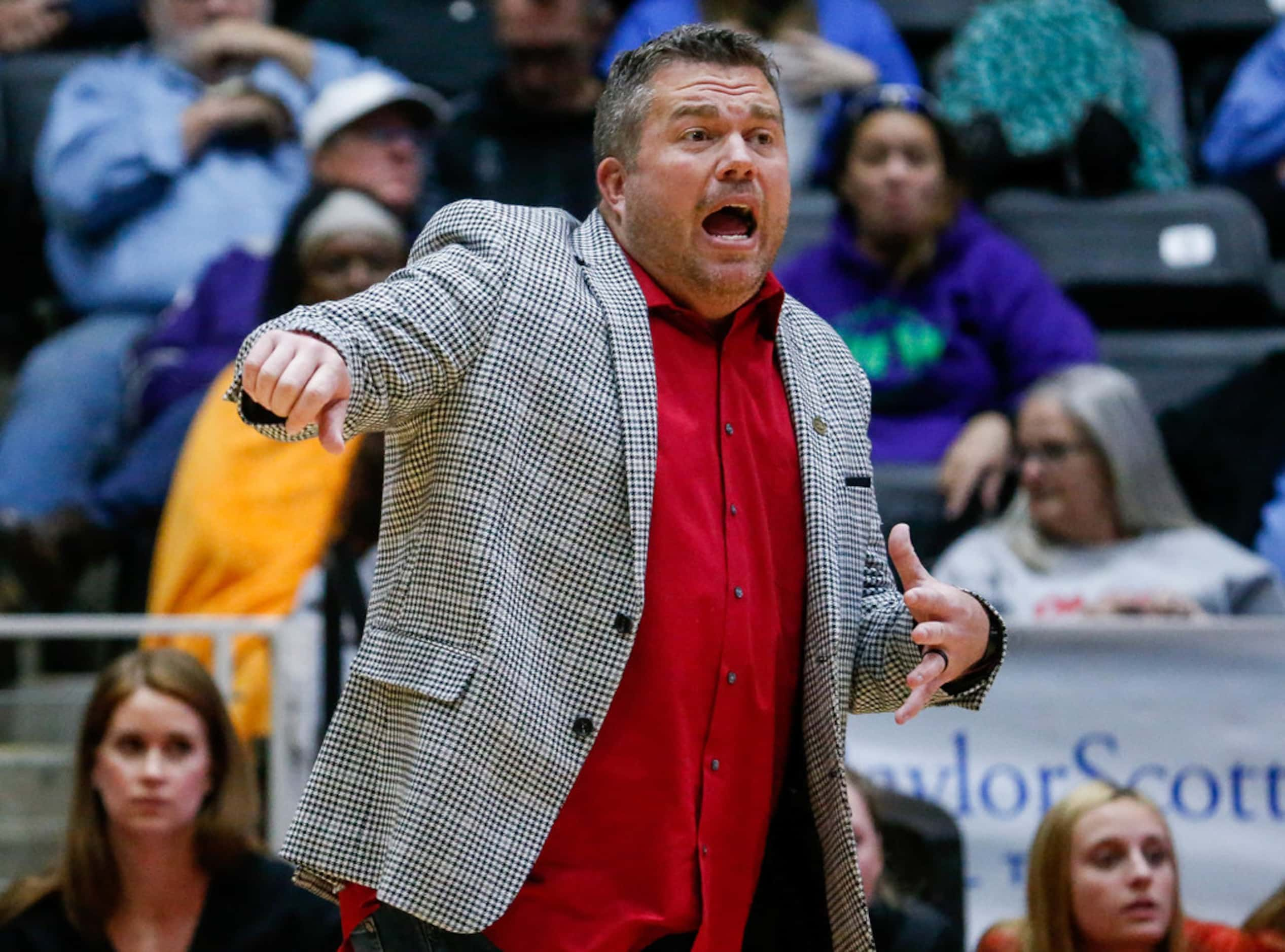 LovejoyÃs coach Ryan Mitchell yells in the first set of a class 5A volleyball state...