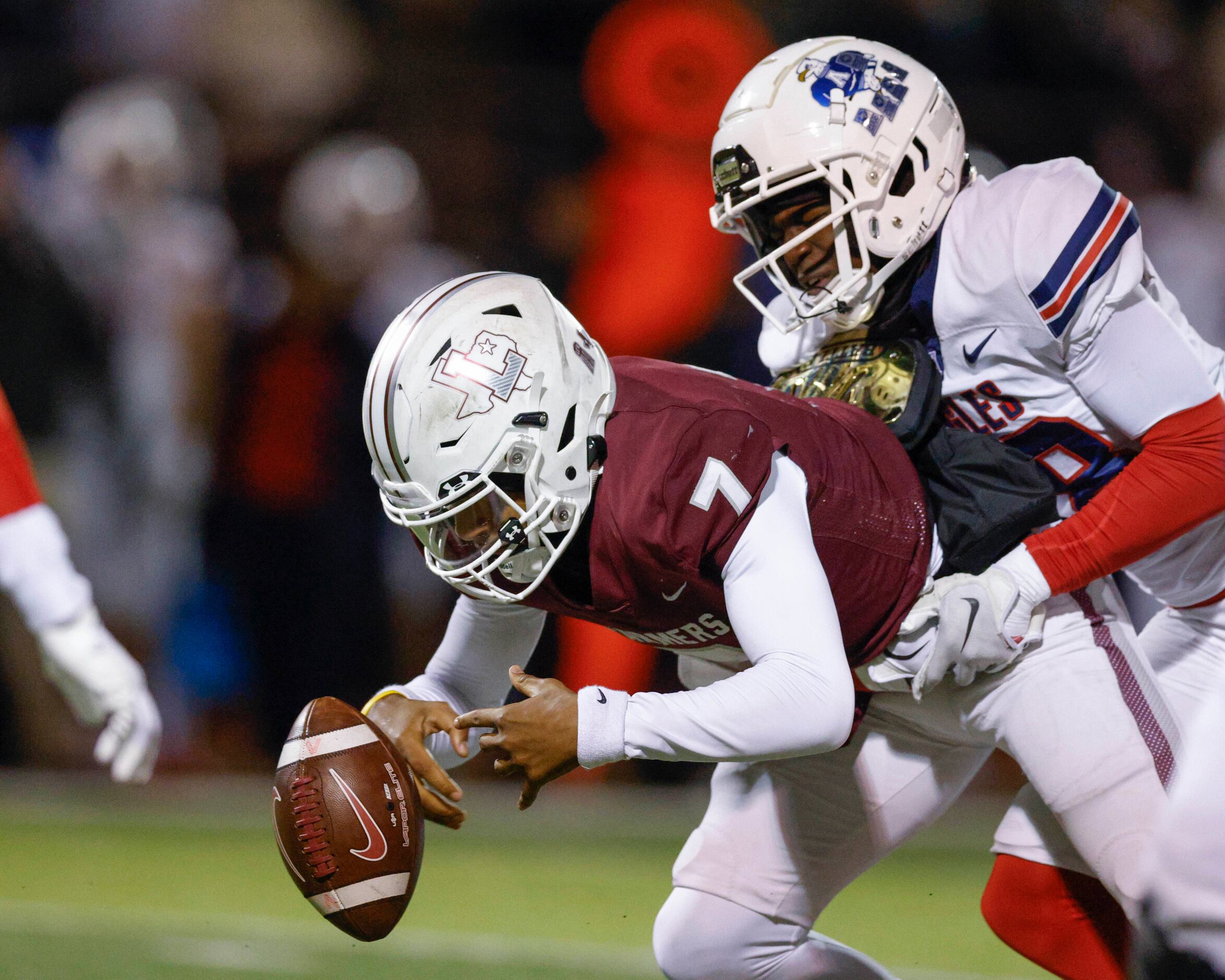 Lewisville quarterback Ethan Terrell (7) fumbles the ball as he’s tackled by an Allen...