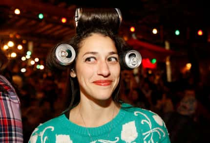 Megan Muller shows off her homemade 'white trash' hair rollers during the Truck Yard's White...