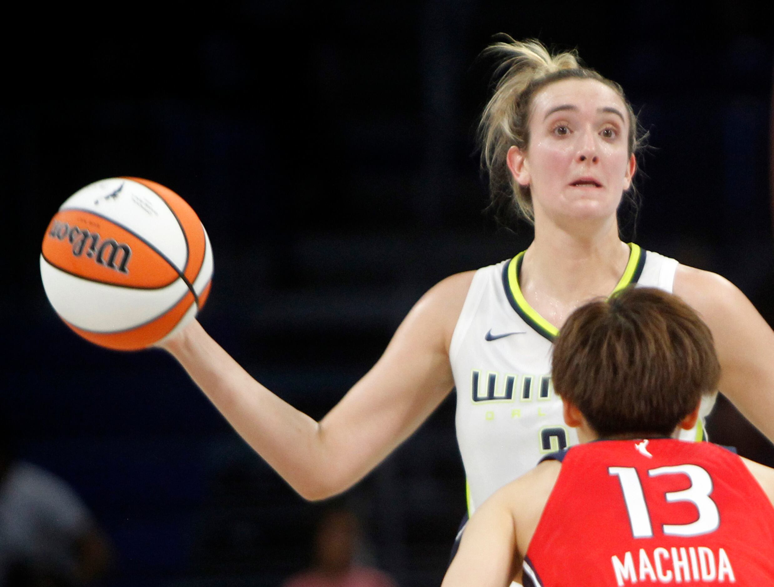 Dallas Wings guard Marina Mabrey (3) looks to pass as she is defended by Washington Mystics...