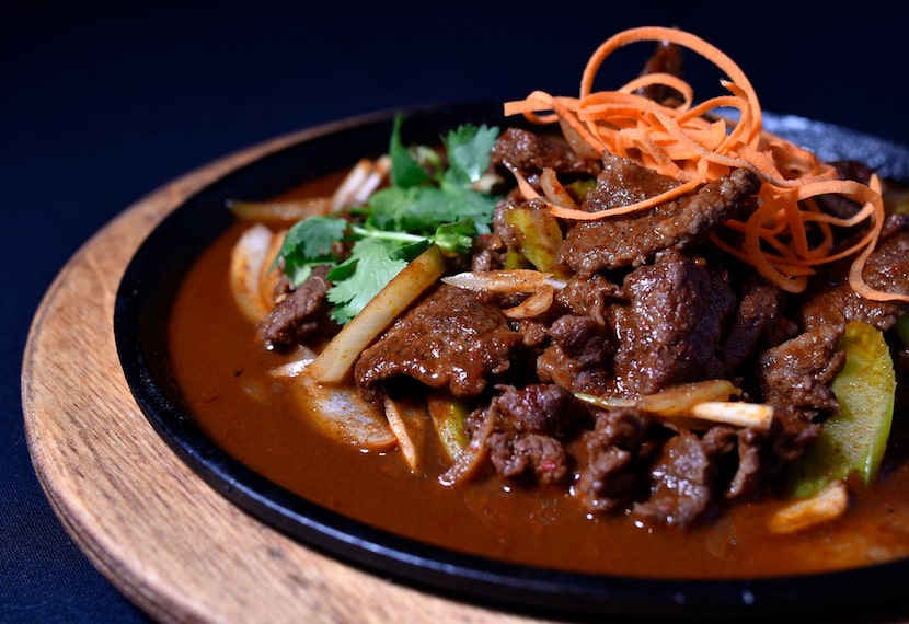 Cumin lamb with onions, bell peppers seasoned with soy sauce and cumin, from Royal China in...