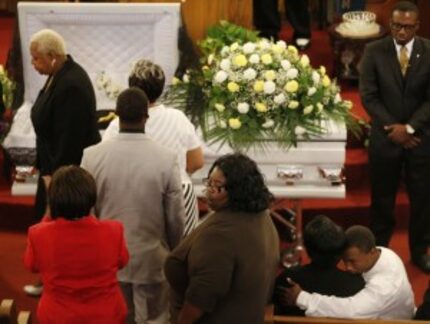  Mourners paid their respects at Saturday's funeral. (Andy Jacobsohn/DMN)