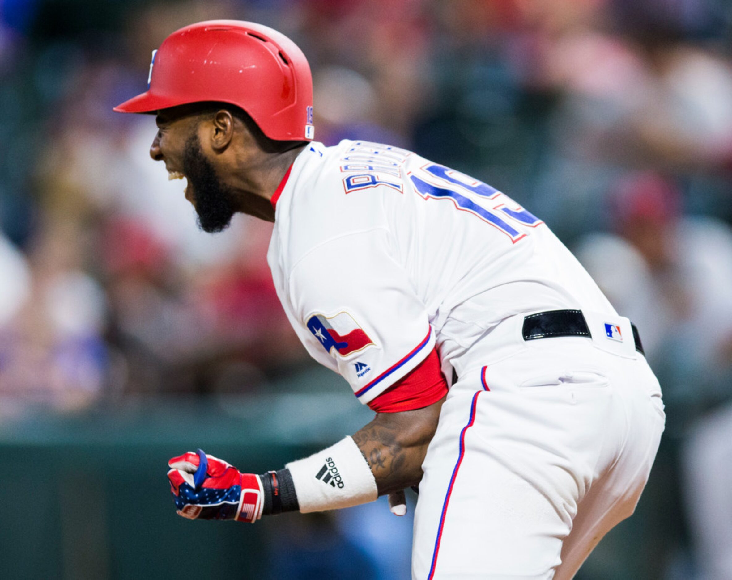 Texas Rangers shortstop Jurickson Profar (19) reacts after being hit by a pitch from Los...