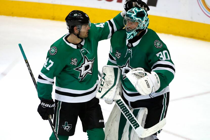 Stars forward Alexander Radulov (47) and goaltender Ben Bishop (30) celebrate following a...