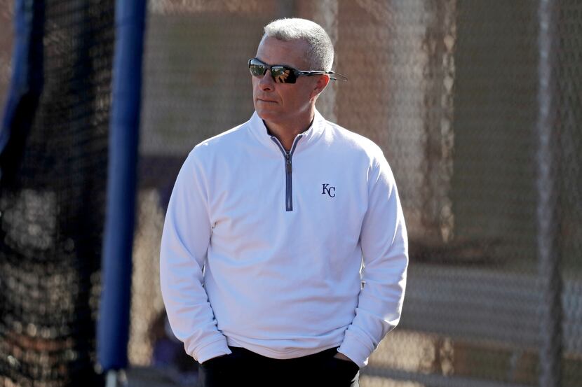 Kansas City Royals general manager Dayton Moore watches a workout during spring training...