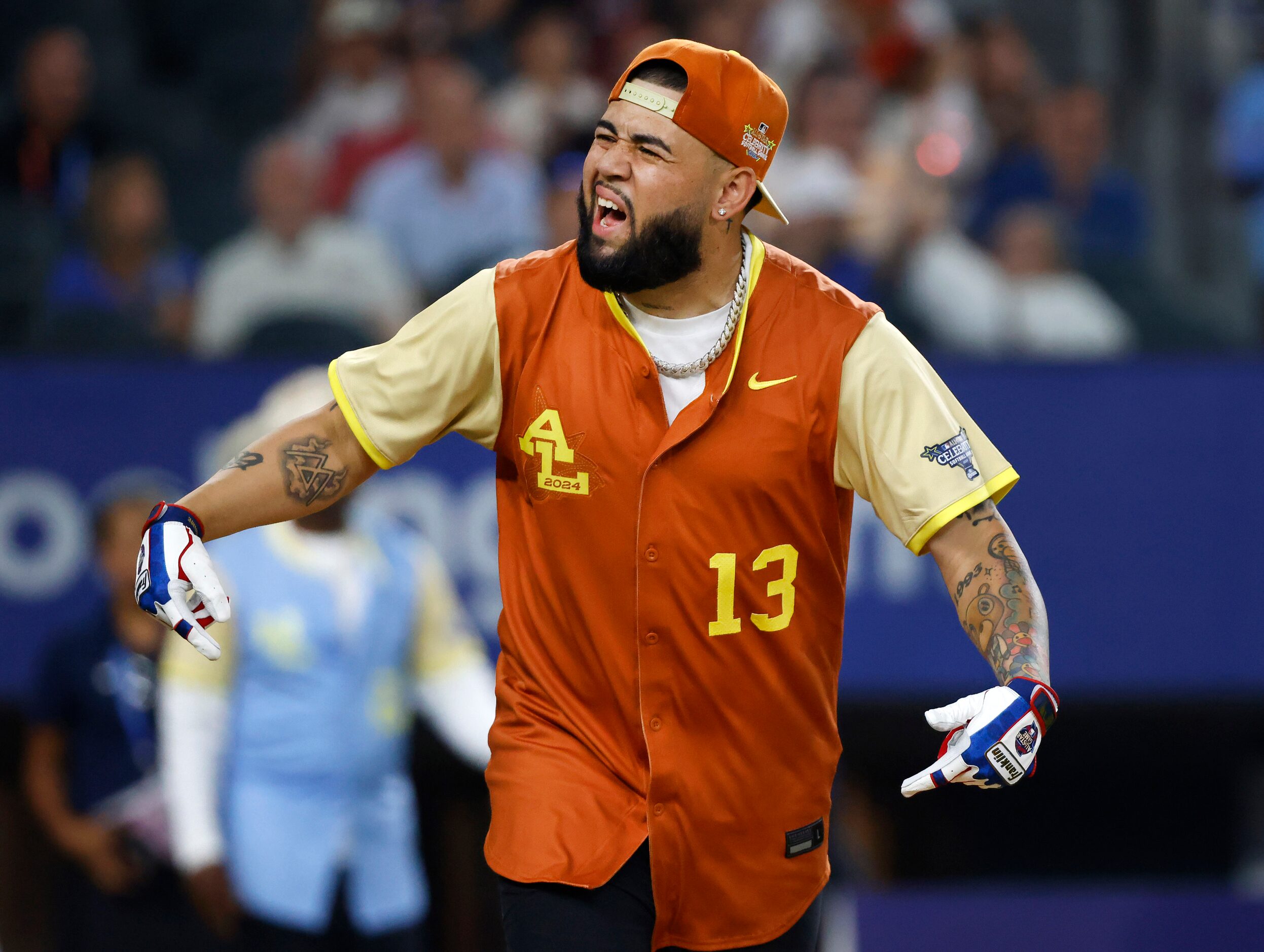 American League batter Foreign Teck reacts  after hitting a first inning homer during the...