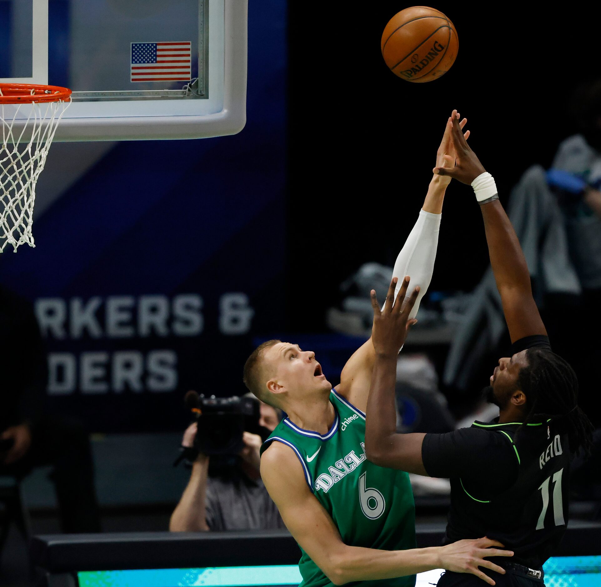 Minnesota Timberwolves center Naz Reid (11) attempts a shot in front of Dallas Mavericks...