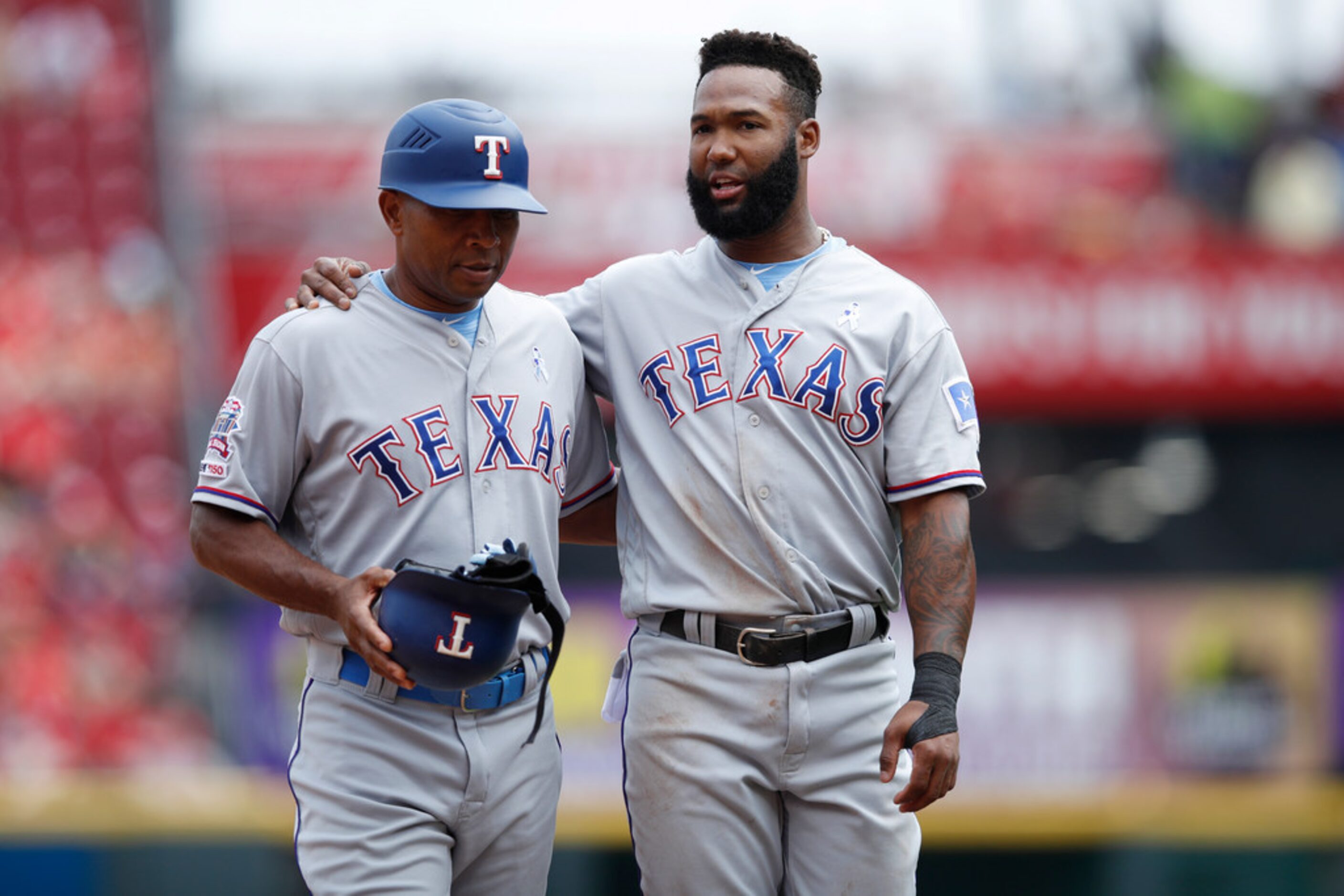 CINCINNATI, OH - JUNE 16: Danny Santana #38 of the Texas Rangers talks with third base coach...