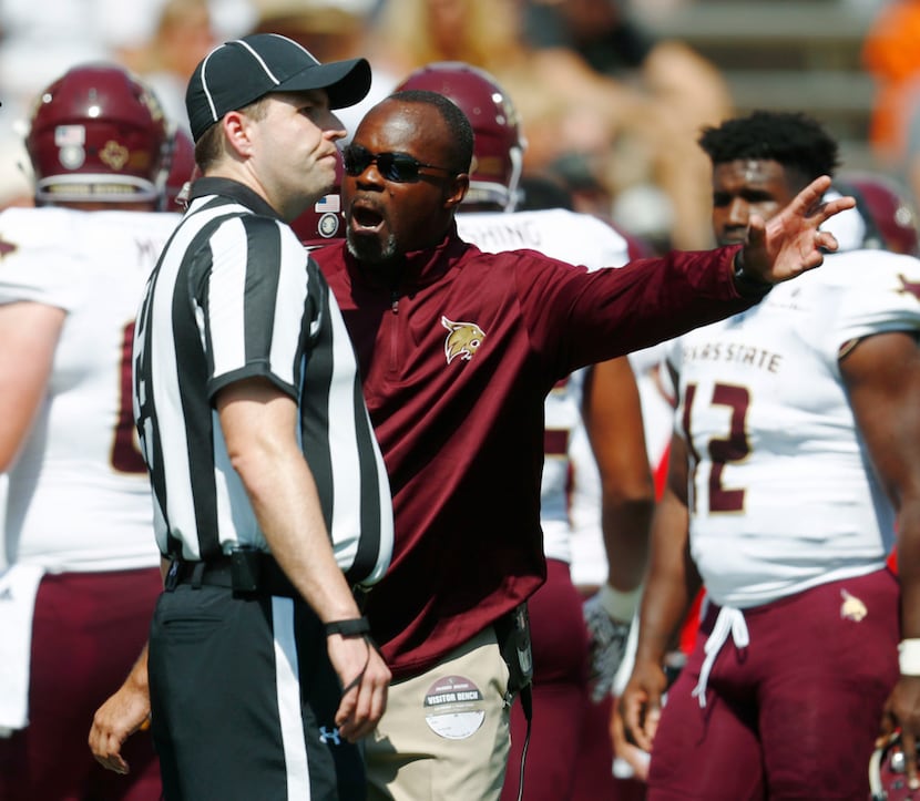 Texas State head coach Everett Withers argues a call with head linesman Jon Stabile while...