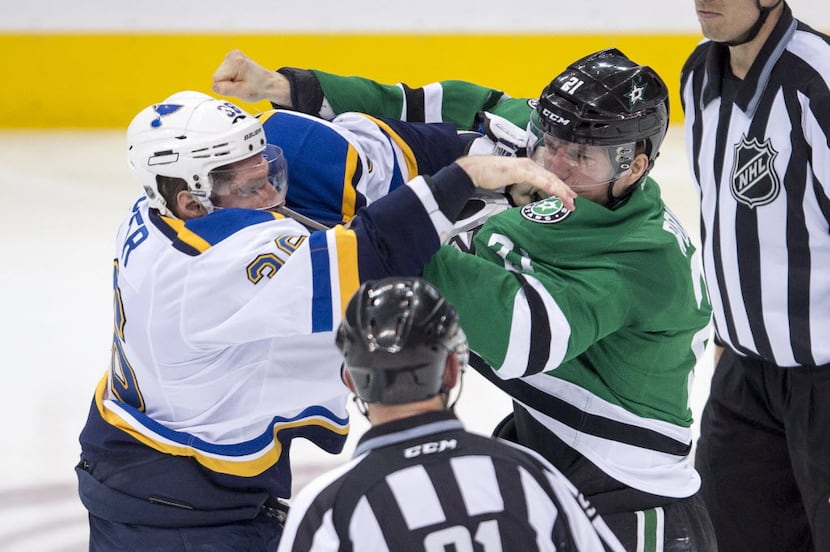 Dec 27, 2015; Dallas, TX, USA; St. Louis Blues right wing Troy Brouwer (36) fights with...