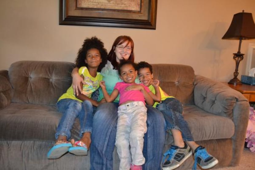 
Kimmy (back center), 28, has lived at Emily’s Place in Plano with her three children since...