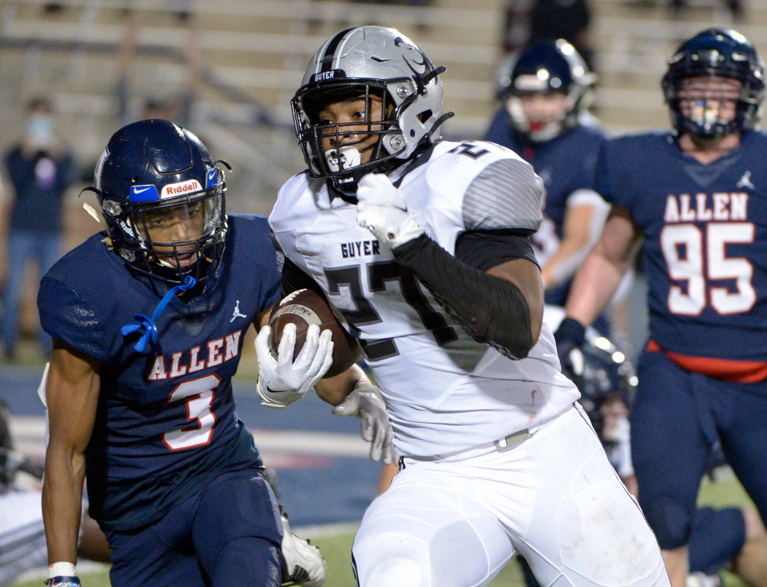 Denton Guyer’s Byron Phillips runs upfield for a touchdown in the third quarter of a high...