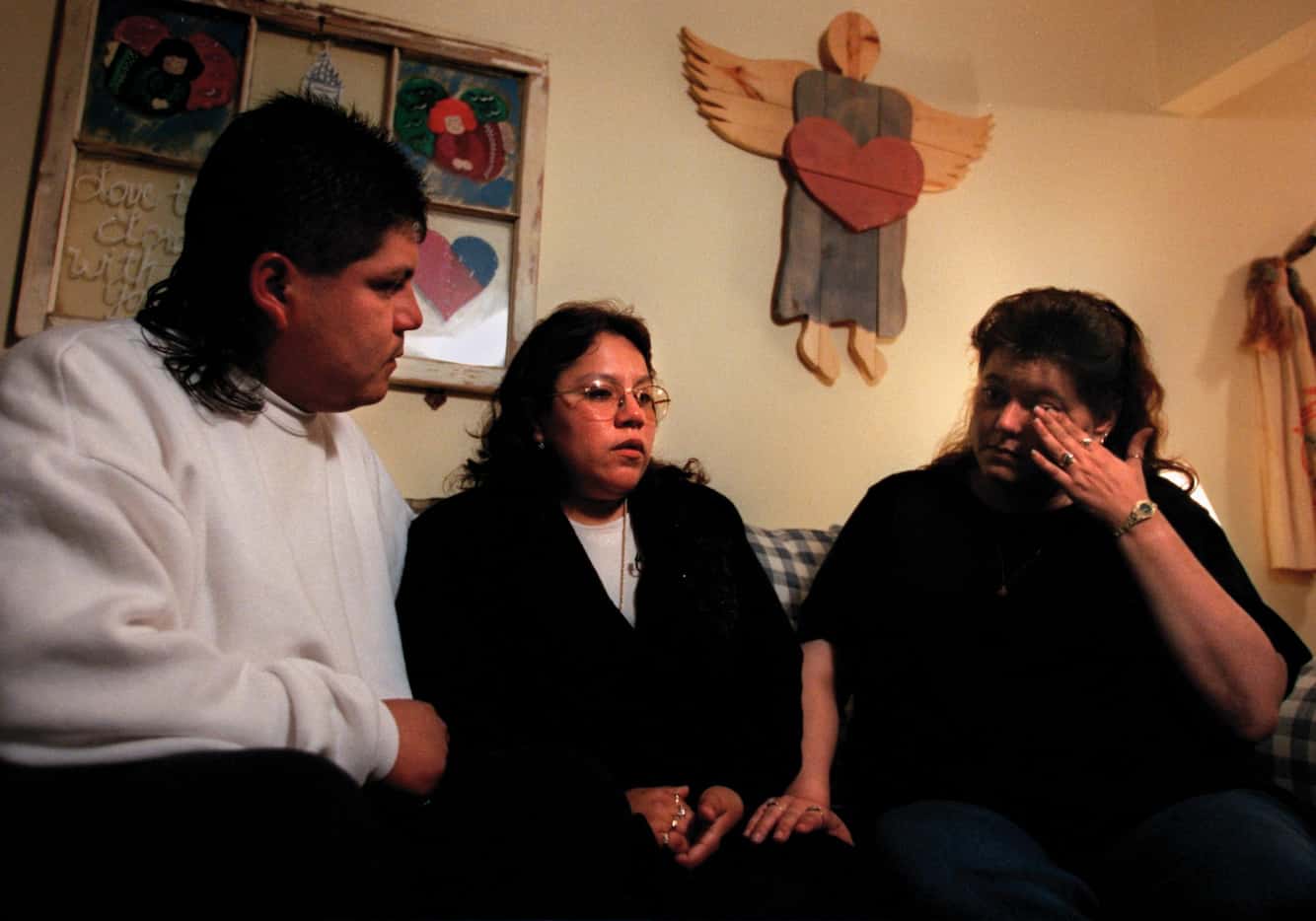 Adalia Villasenor, center, widow of Agustin Villasenor a murder victim at the Mi-T-Fine...
