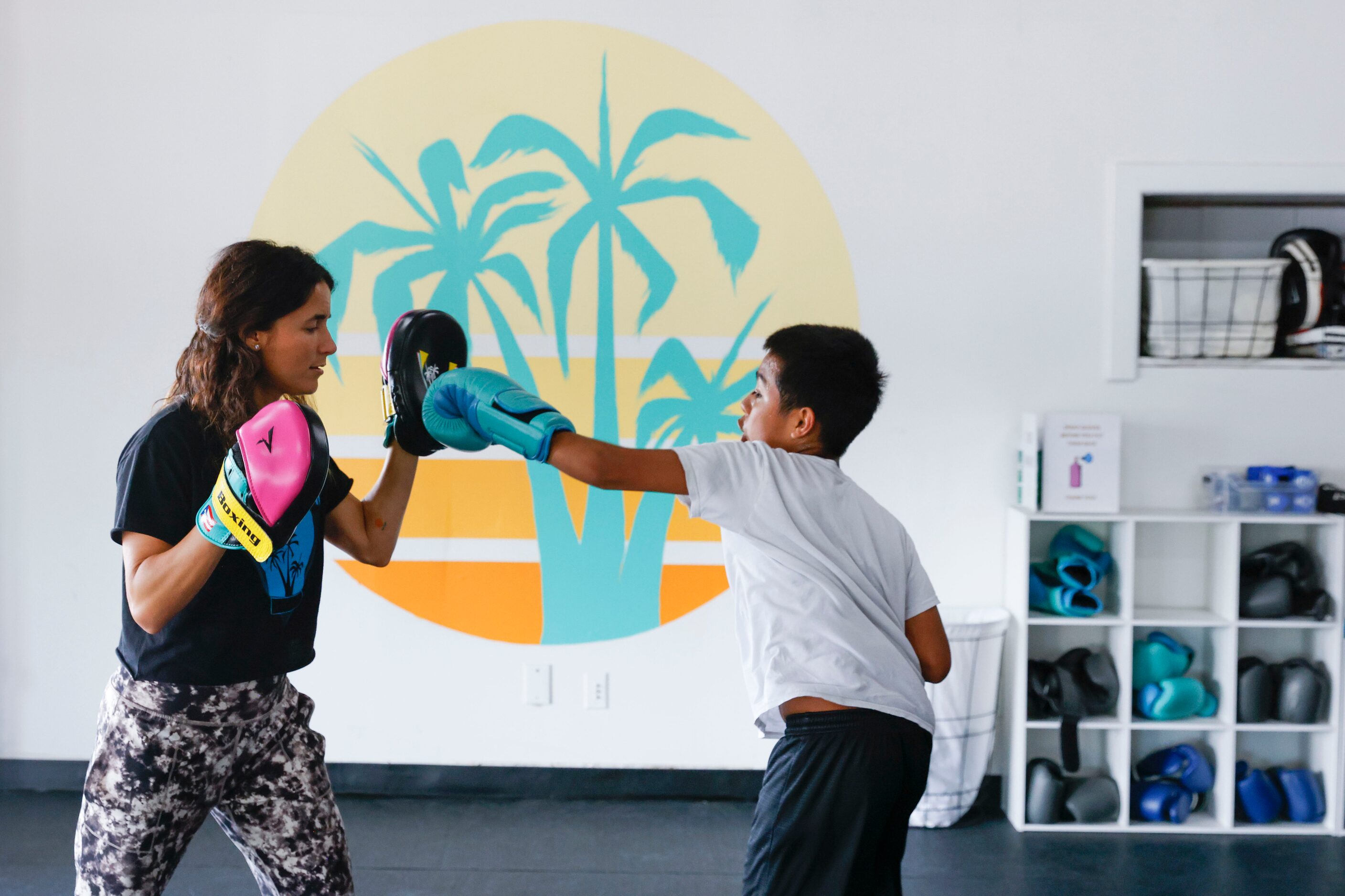 Amanda Alvarez, a salsa teacher and boxing lover, trains Nefi Guerrero during a boxing...