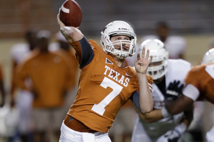 Texas quarterback Connor Brewer throws during the team's spring football game, Saturday,...