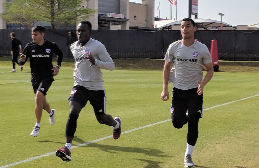 Vander Salas (left), FC Dallas' Assistant Athletic Performance Coach, works Francis Atuahene...