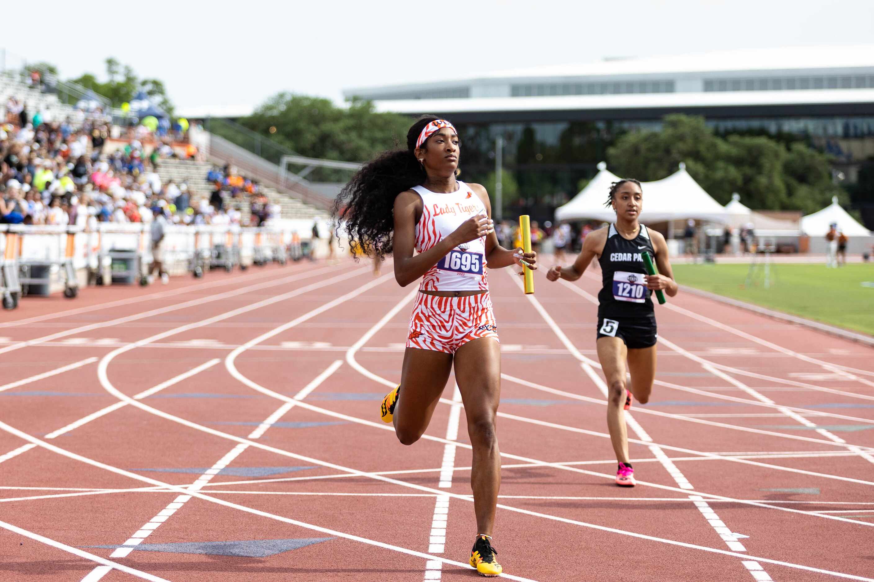 Trelondra Strong of Lancaster reacts to a third-place finish in the girls’ 4x100 relay at...