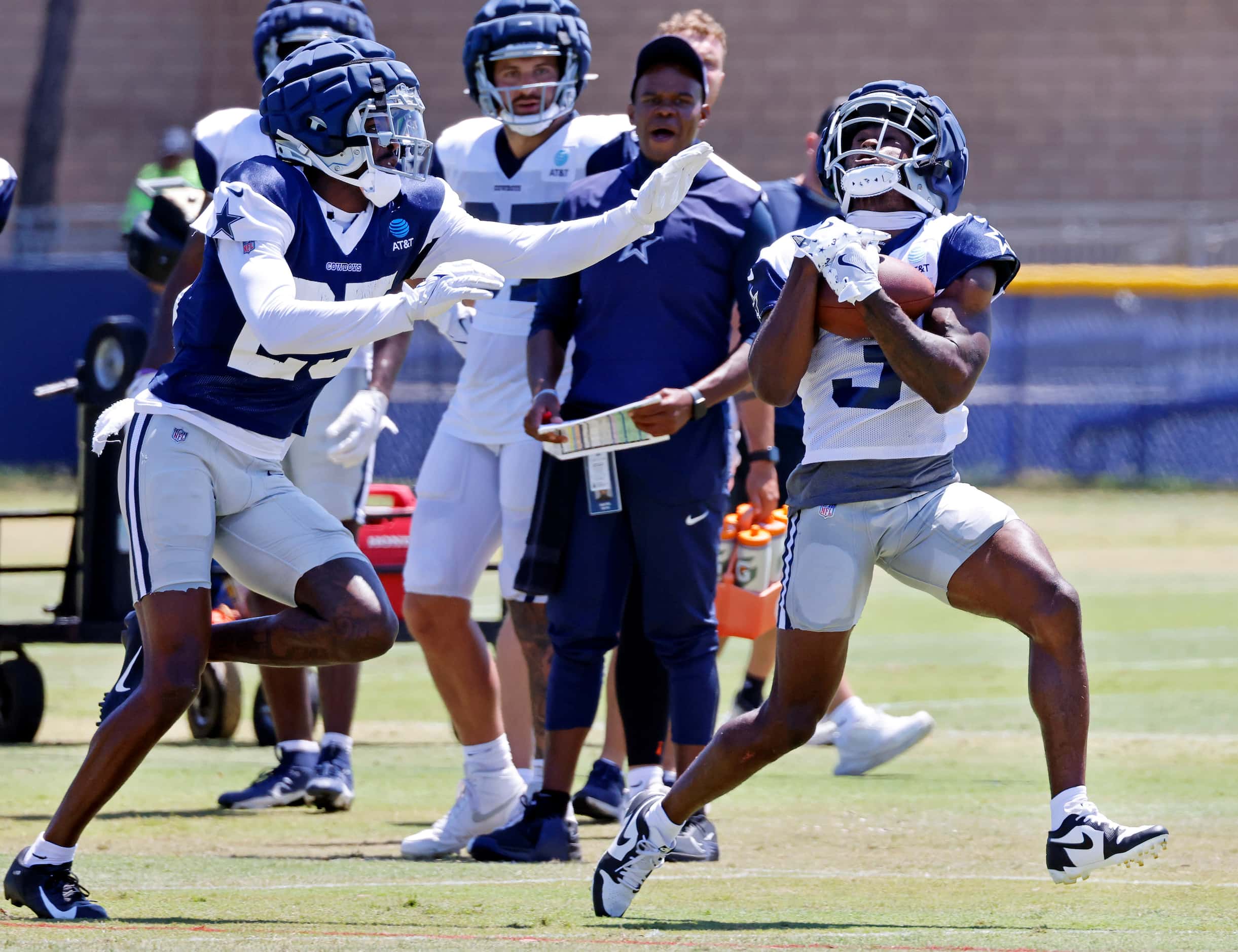 Dallas Cowboys wide receiver Brandin Cooks (3) pulls in a long pass in front of cornerback...