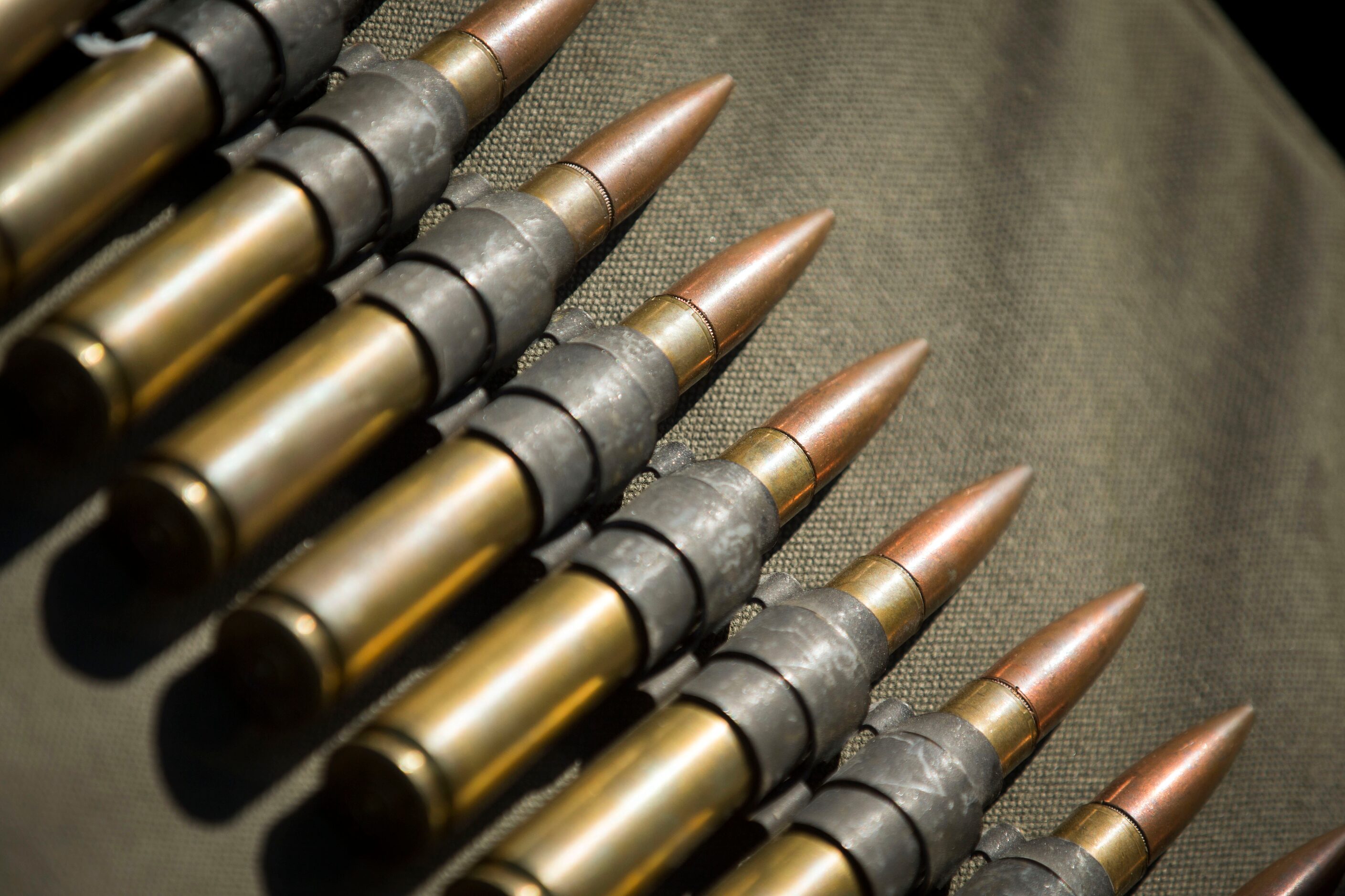 50 caliber rounds lie in a row during the Commemorative Air Force Wings Over Dallas WWII...