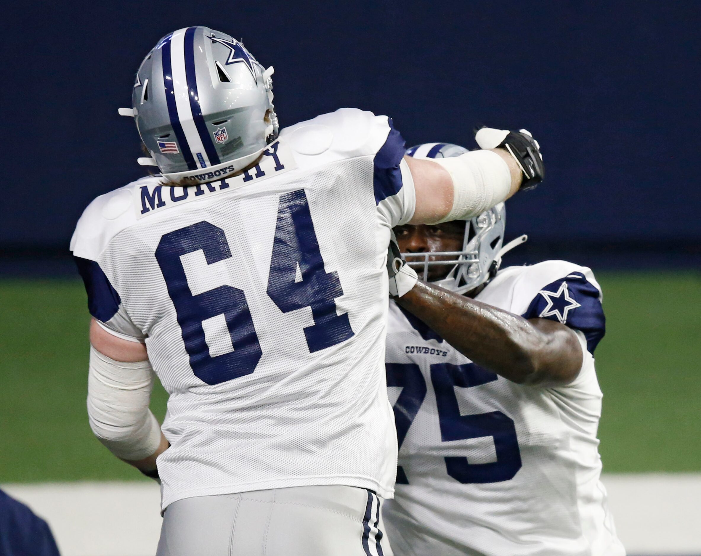 Dallas Cowboys offensive tackle Cameron Erving (75) blocks Dallas Cowboys offensive tackle...