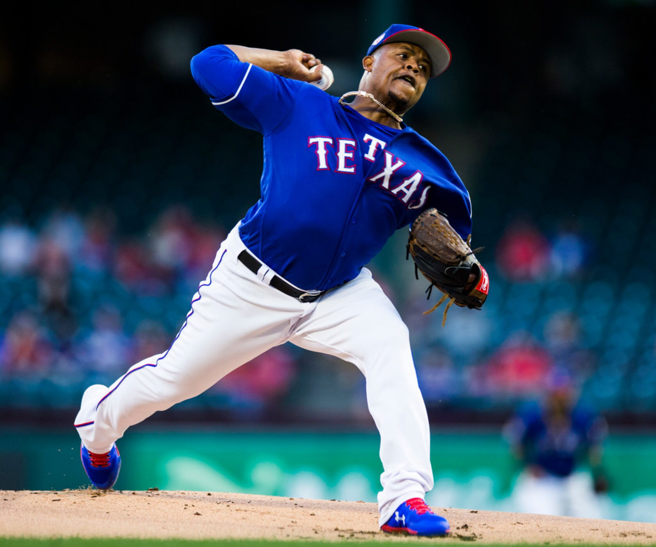 Texas Rangers starting pitcher Edinson Volquez (36) pitches during the first inning of a...