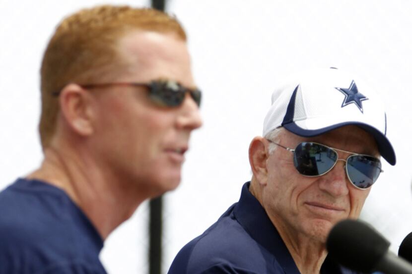 Dallas Cowboys owner looks at Dallas Cowboys head coach Jason Garrett as he answers...