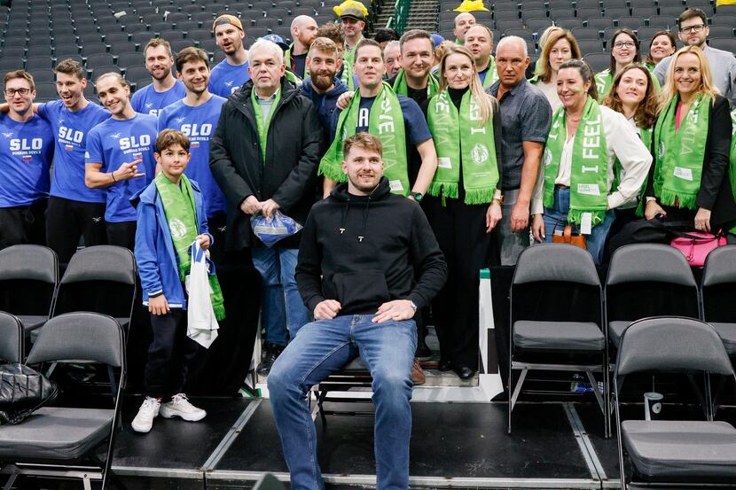 Dallas Mavericks guard Luka Doncic poses for a photo with Slovenian fans after an NBA game,...