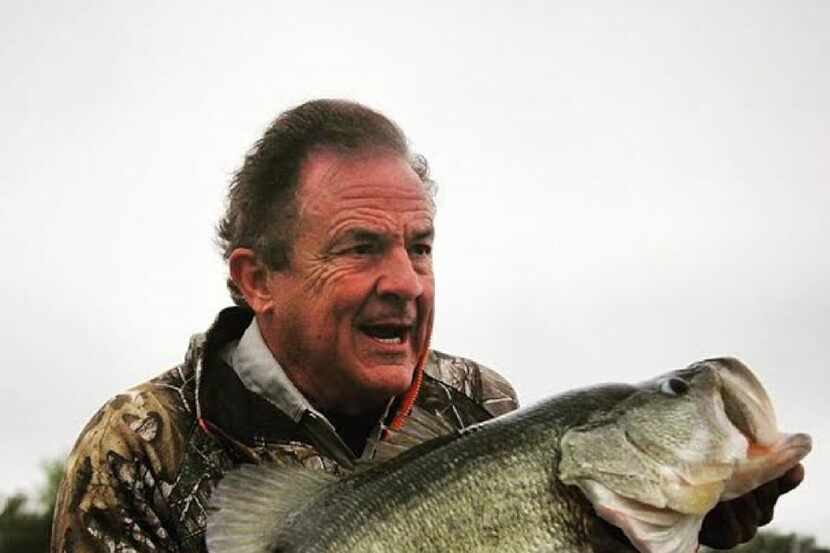 Gary Schwarz with a 15-pound bass caught during a fishing survey at his Webb County Ranch....