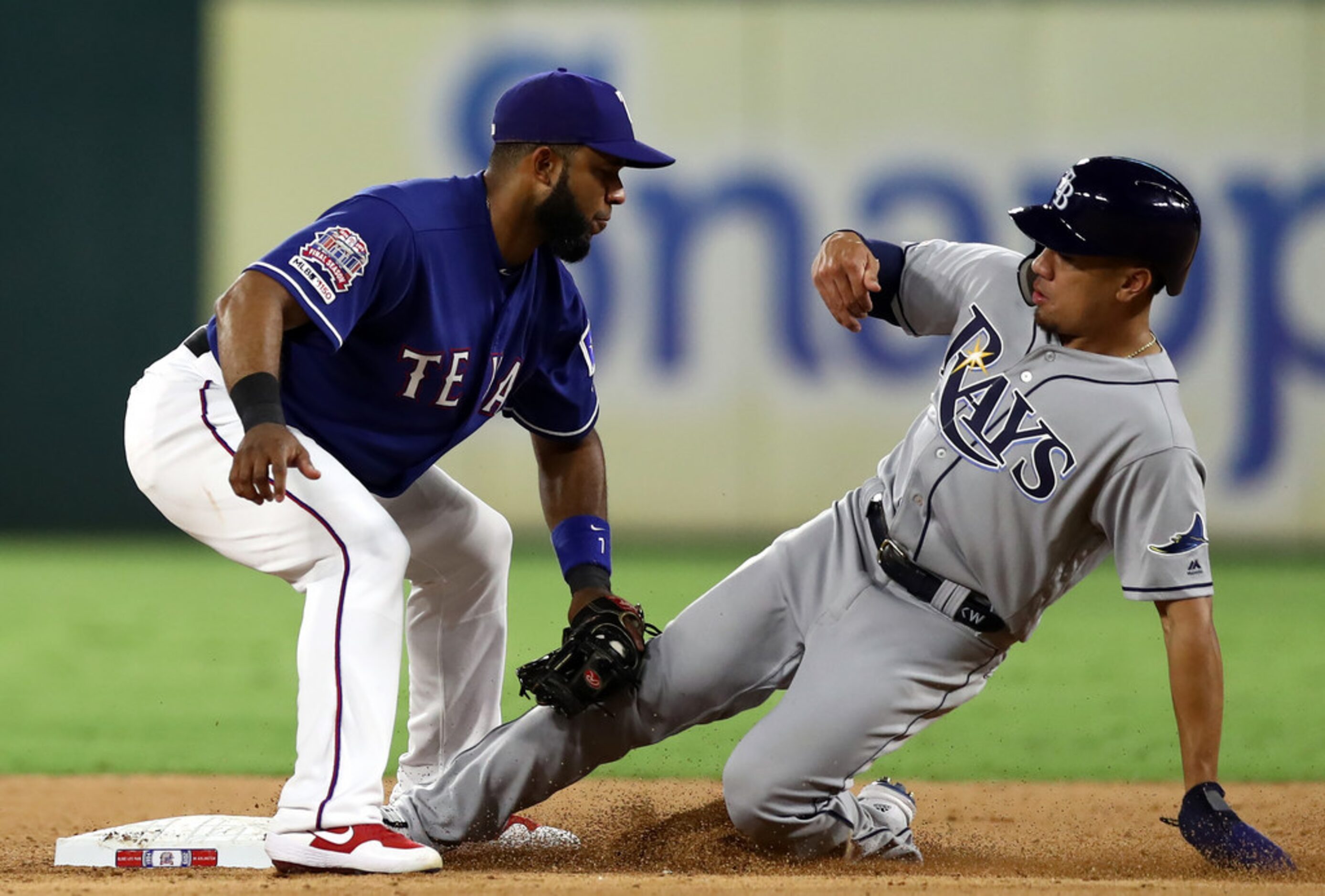 ARLINGTON, TEXAS - SEPTEMBER 10:  Elvis Andrus #1 of the Texas Rangers makes the out on the...