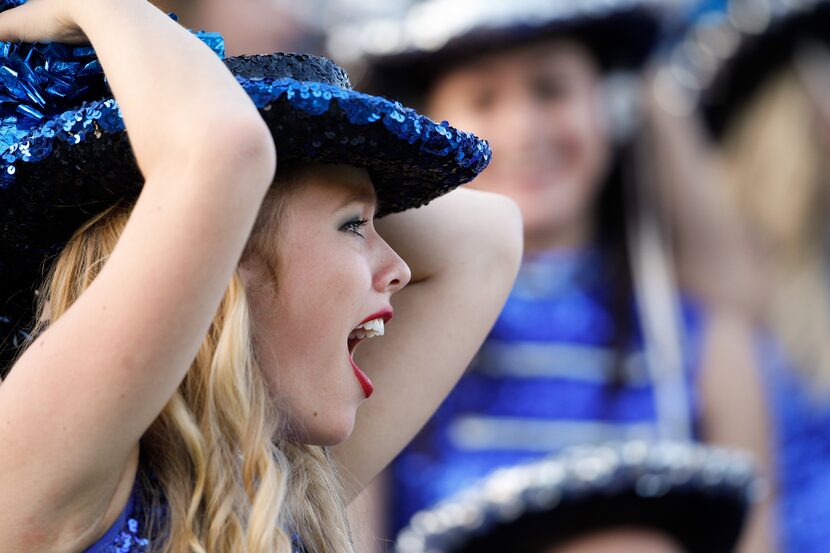 A Plano West cheerleader reacts to a successful onside kick against Austin Westlake in the...