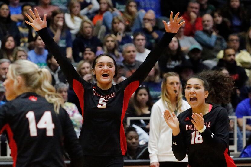 Colleyville Heritage High School's Suli Davis (5) leads the reaction to winning a point...