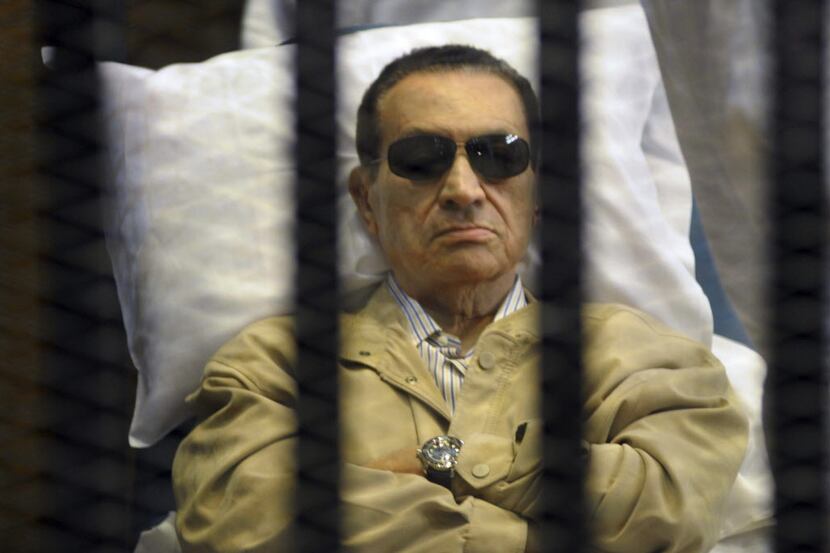 FILE - In this June 2, 2012 file photo, Egypt's ex-President Hosni Mubarak lays on a gurney...