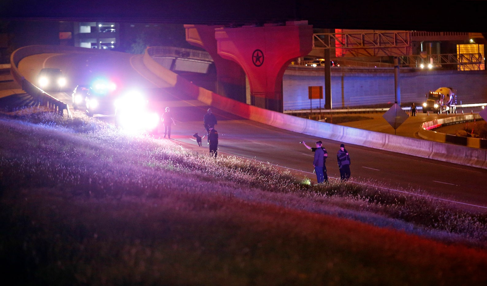 Police search for evidence near the Texas Tech Police Department on Monday night. 