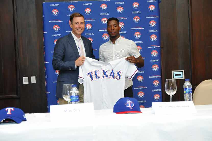 Mike Daly, Texas Rangers Assistant General Manager, and prospect Julio Pablo Martinez at a...