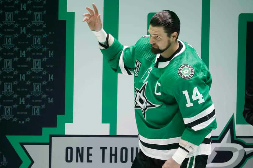 Dallas Stars left wing Jamie Benn (14)  waves during a ceremony honoring his 1000th NHL game...