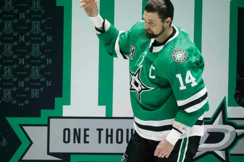 Dallas Stars left wing Jamie Benn (14)  waves during a ceremony honoring his 1000th NHL game...