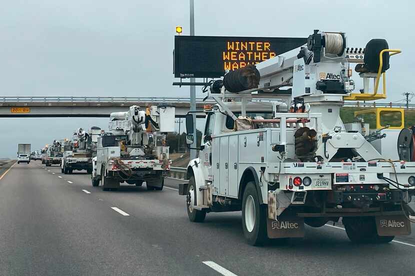 A caravan of utility crews with Sumter Utilities out of South Carolina heads toward the...