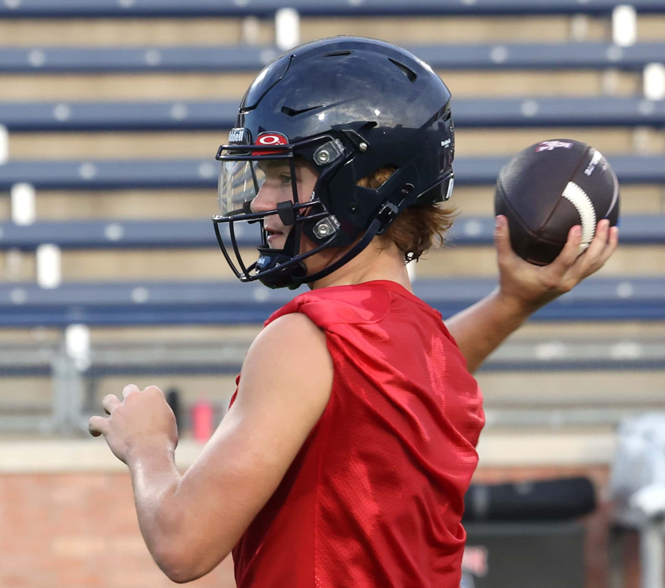 Allen quarterback Brady Bricker sets to pass across the middle during an early morning...