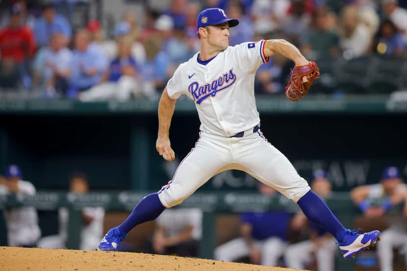 Texas Rangers relief pitcher David Robertson delivers a pitch during the eighth inning of a...