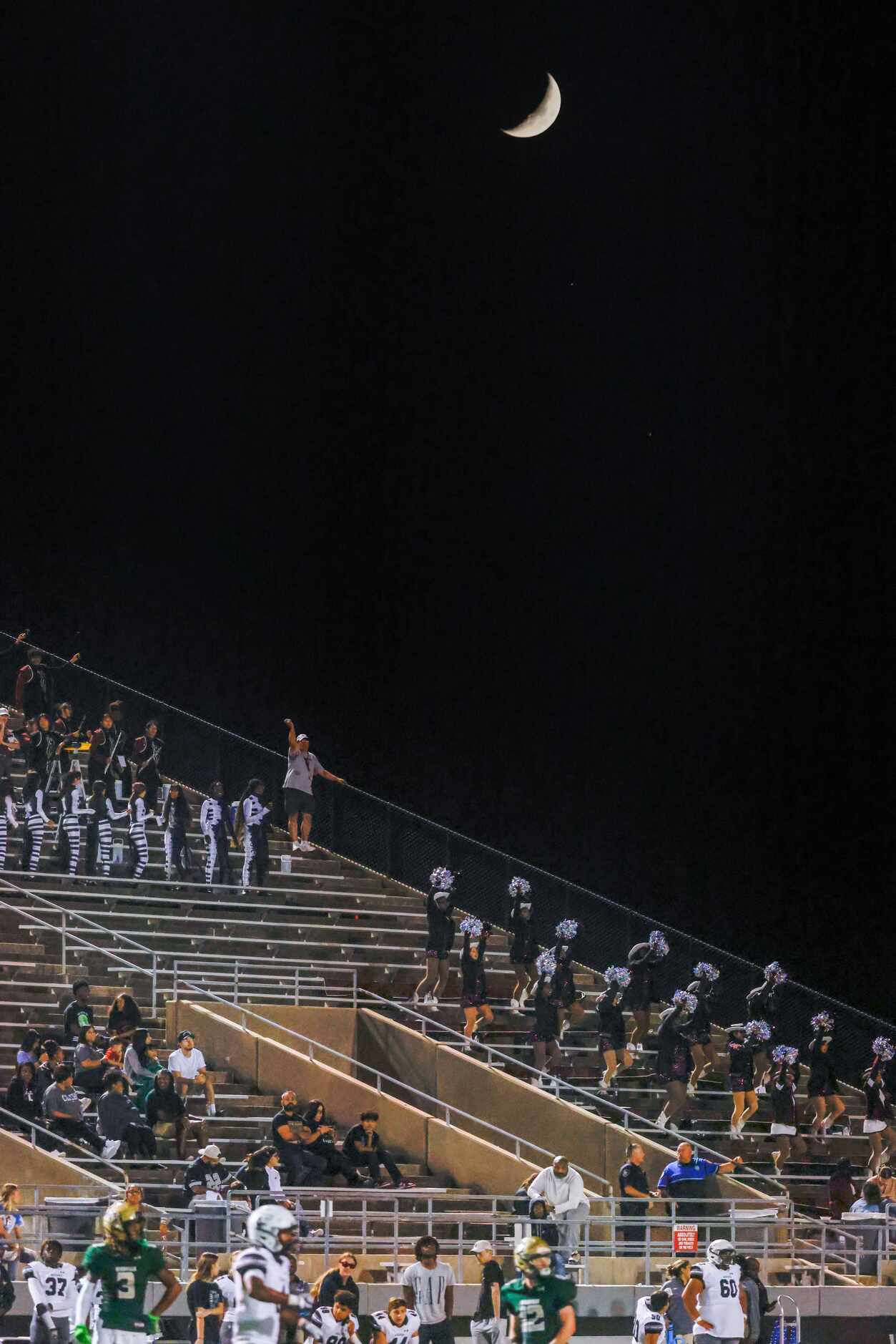 Mansfield Timberview drill team and band members cheer for their team as they play Birdville...