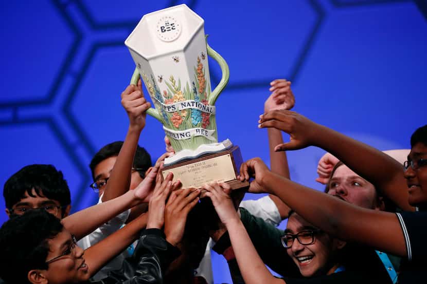 Eight co-champions celebrate after winning the Scripps National Spelling Bee, Friday, May...