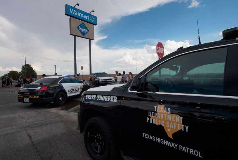 Police and state troopers kept watch outside the Cielo Vista Mall Walmart in El Paso on Aug....