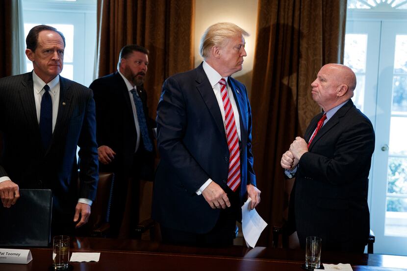 President Donald Trump speaks with Rep. Kevin Brady, R-The Woodlands, after a meeting with...