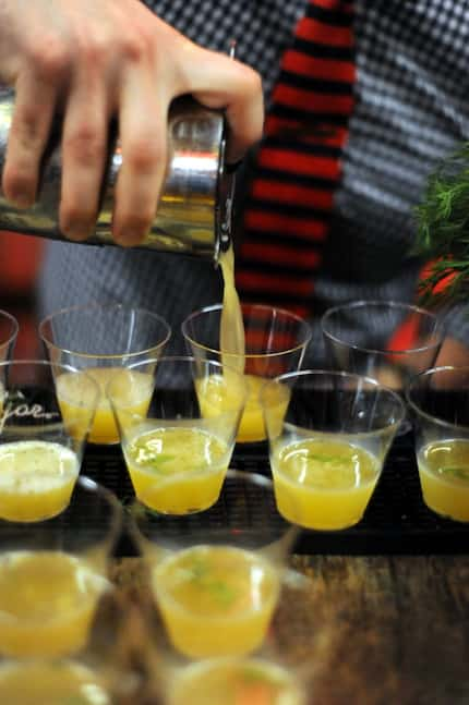 Bartenders pour cocktails at the 2015 DFW Restaurant Week kick-off party at Sixty Five...